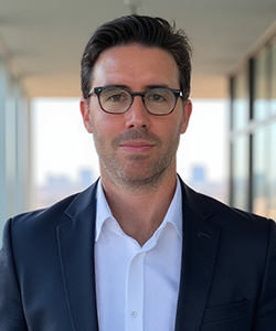 Headshot of Adrian Castro, Managing Director